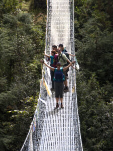 Trekkers on the bridge across the Dudh Kosi below Namche bazaar