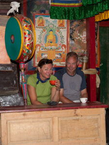 Trekkers being served tea at Choser Gompa in the Mustang region of Nepal