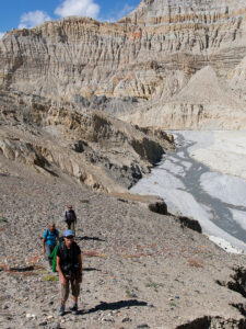 Trekkers climbing from the Mustang river to Dhi in the Mustang region of Nepal