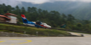 Summit air plane taking off down the famous Lukla airport runway in Nepal