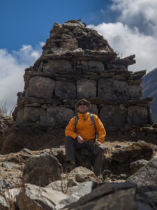 Trekker taking a rest just below Mundu on the Langtang trek in Nepal