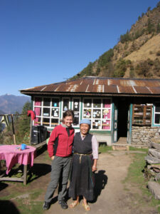 Trekker and local lady at Rimche on the Langtang trek in Nepal