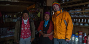 Trekker and hosts in a Kyangjin tea house on the Langtang Trek