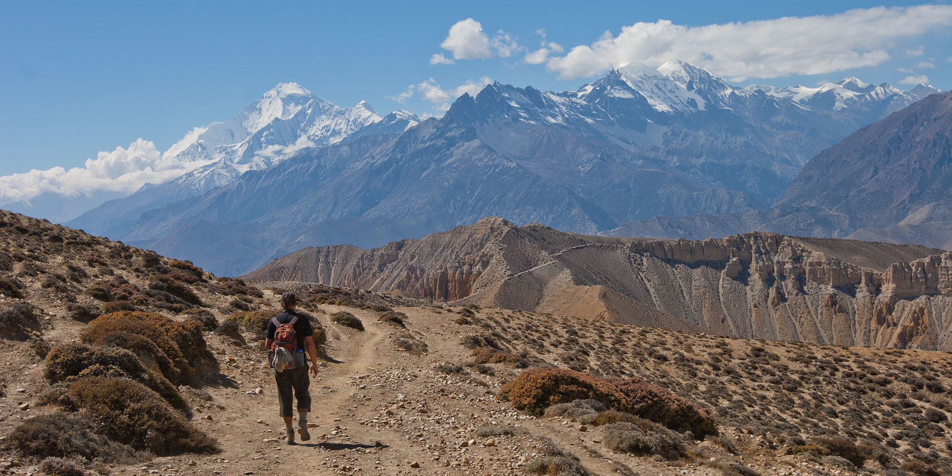 Trekker on the trail to Tetang from Tangye in Mustang