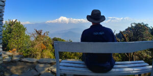 Trekker enjoying the view from Panchase top on the Panchase trek in Nepal
