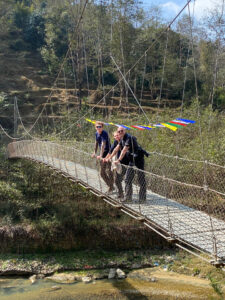 Trekkers on bridge below Balthali on the Balthali trek in Nepal