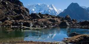 Rahtong and Kabru reflecting in a little lake above Tseram in the Kanchenjunga region of eastern Nepal