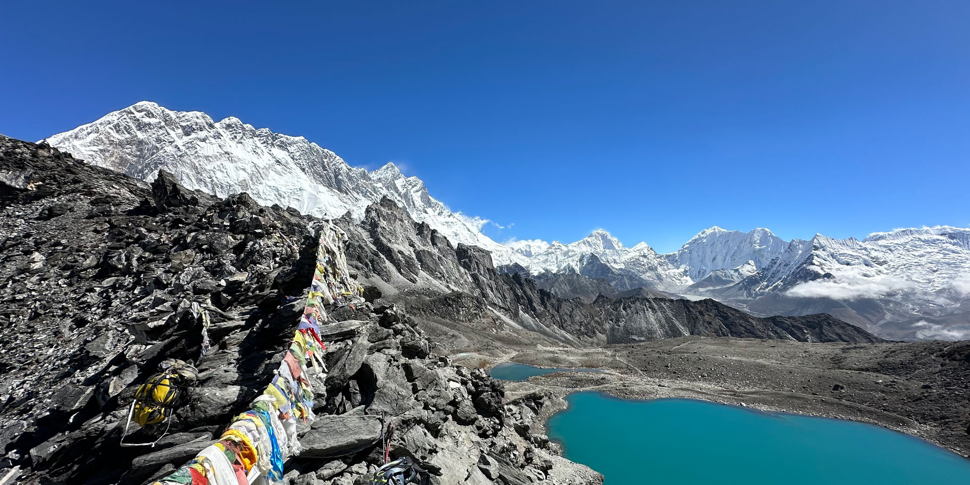 Lhotse wall, Makalu and Baruntse seen from Kongma La pass with prayer flags on the 3 passes trek in the Everest area of Nepal