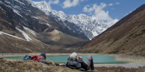 Rest at Chhohajina Lake with Phungphung Chuli 6102 in background in Shey Phuoksundo national park, Dolpo