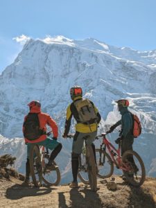 Bikers enjoying the view of Annapurna II from just below Ice Lake on the Annapurna Circuit in Nepal