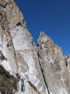 Bikers tackling a steep section of trail near old Khangsar on the trail from Tilicho back to the Annapurna circuit