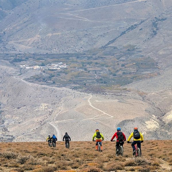 Riders descending from Lupra to Ekle Bhatti in the Kali Gandaki valley of Lower Mustang. Across the valley is hte village of Phallyak