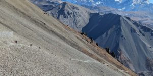 Bikers pushing their bikes to Tilicho Lake on the Annapurna circuit