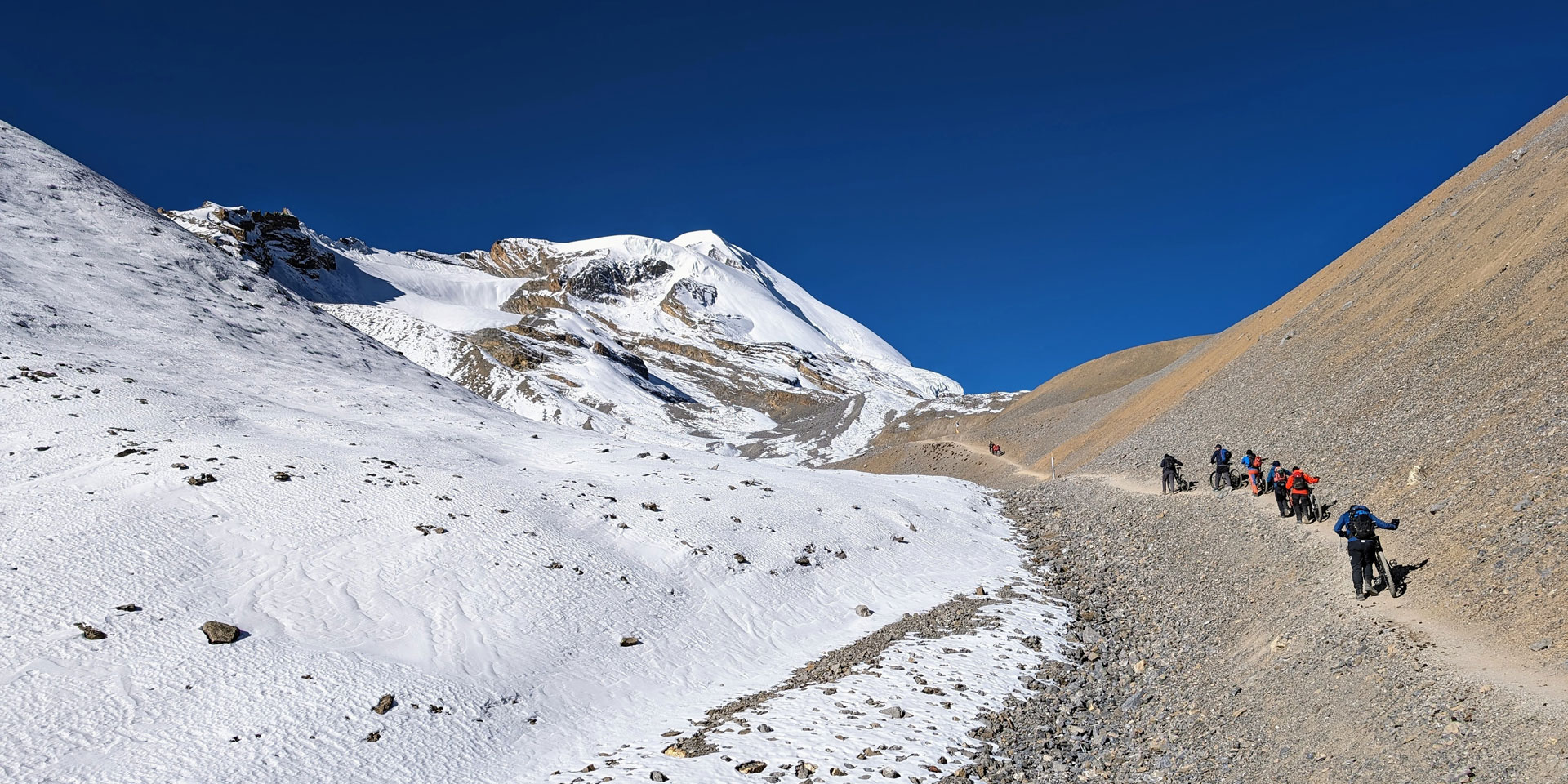 Mountain bikers making their way to Thorung La pass 5416m from Dharmasala on the Annapurna circuit