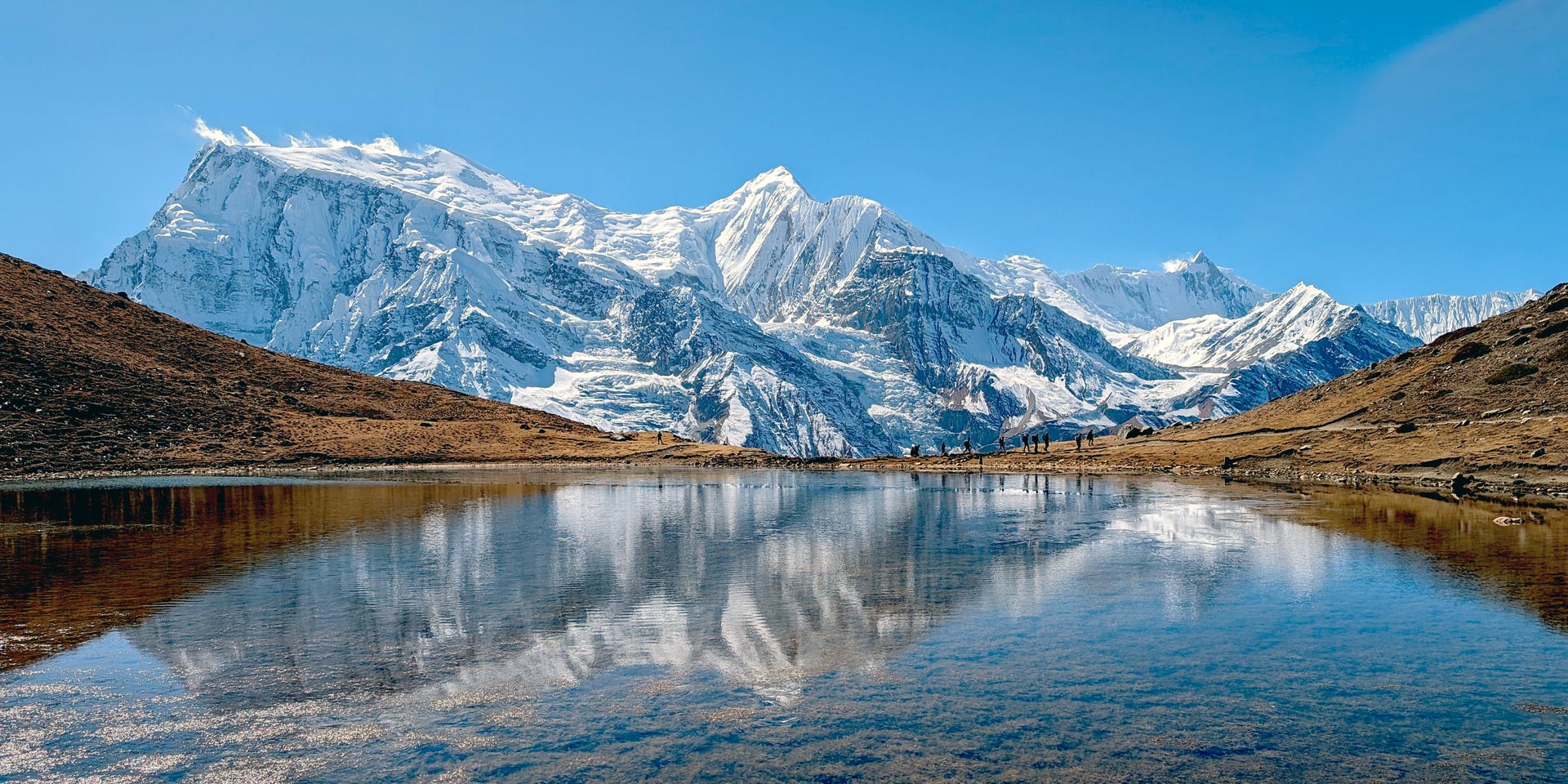 Annapurna III, Ganga Purna and Khangsar peaks seen from little Ice lake above Braga in the Manang valley on the Annapurna circuit