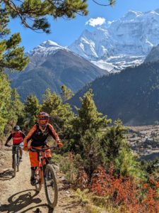 Mountain bikers on the trail from Upper Pisang to Green Lake in the Manang valley on the Annapurna circuit