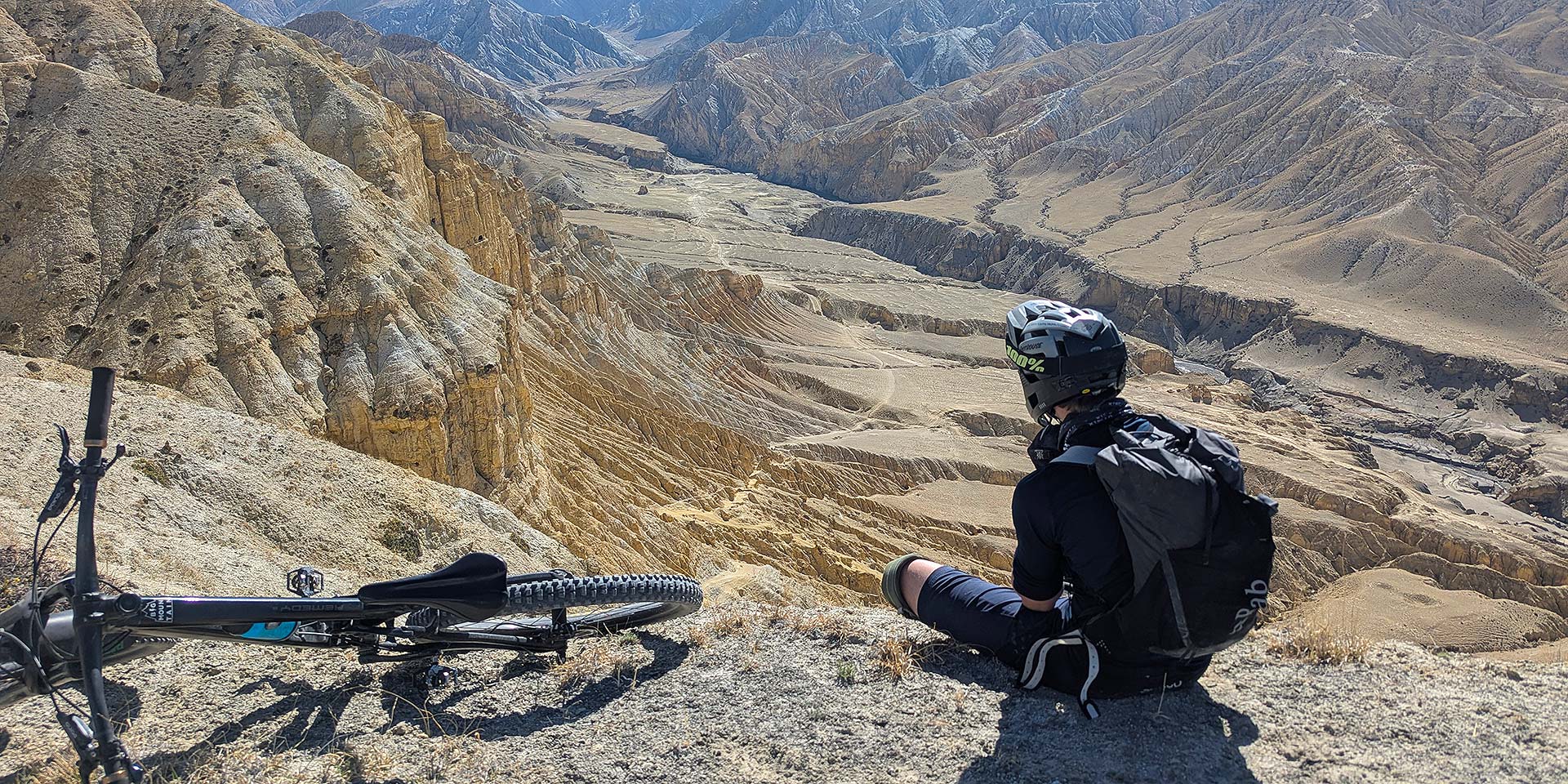 Rider contemplating single trail options in the Samdzong valley of Upper Mustang, Nepal
