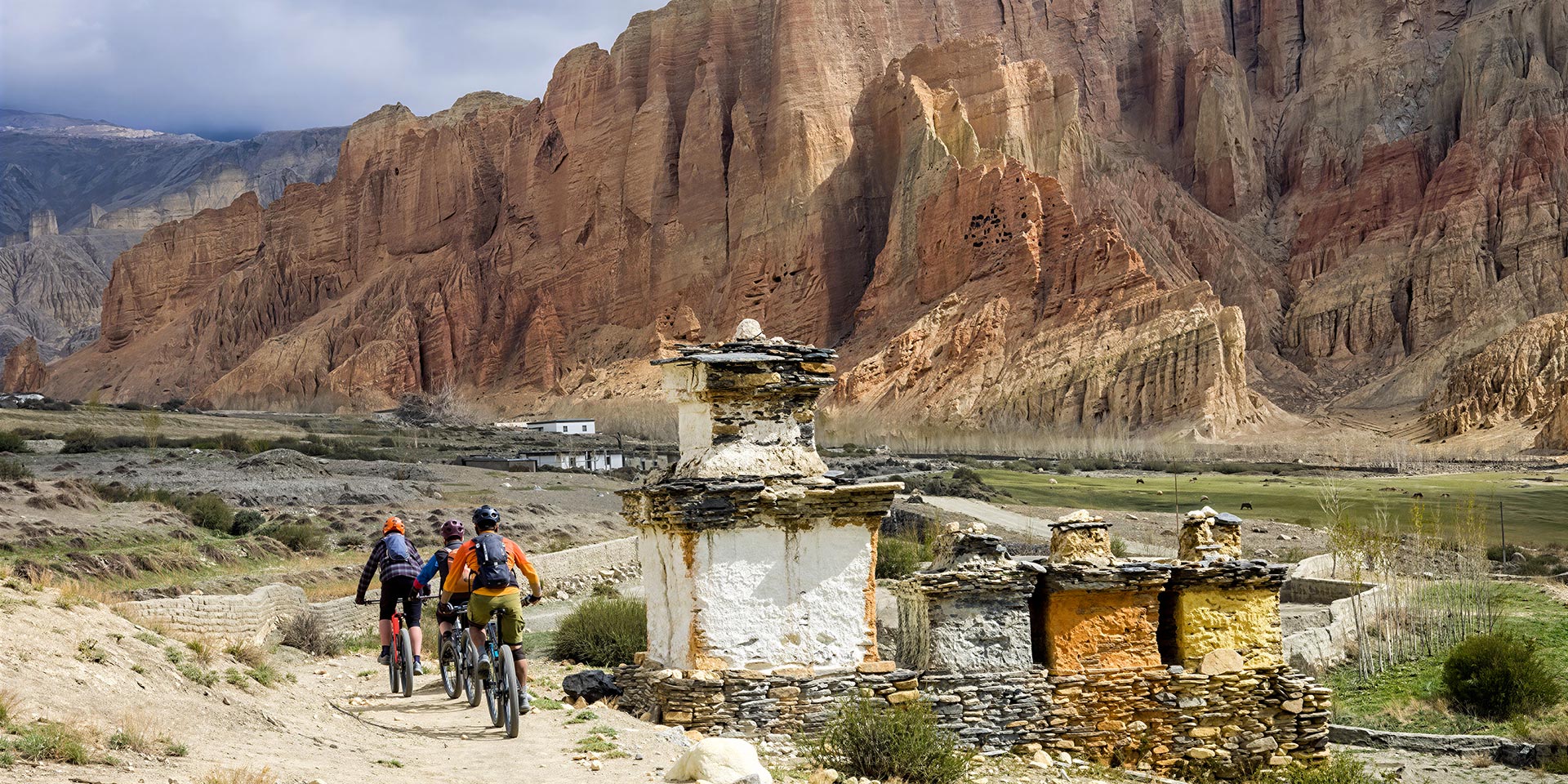 Riding the trail between Dhakmar an Ghami in Upper Mustang, Nepal